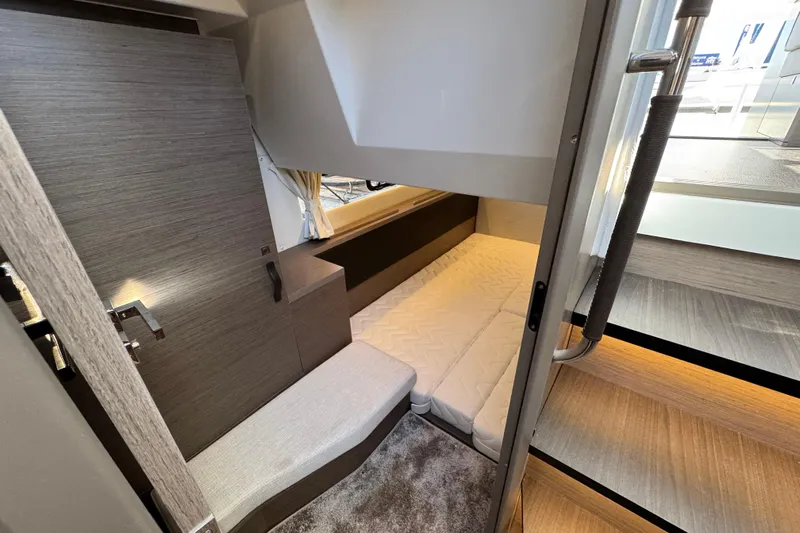  Yacht Photos Pics 2026 Jeanneau NC 1295 Coupe interior cabin with modern design and cozy seating.