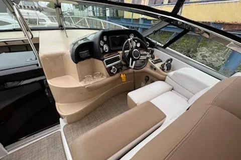  Yacht Photos Pics 2015 Four Winns 375 Vista boat cockpit with modern controls and beige seating.