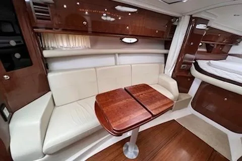  Yacht Photos Pics 2015 Four Winns 375 Vista yacht interior with elegant seating and wooden table.
