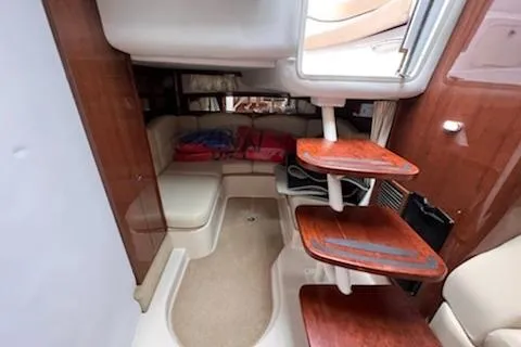  Yacht Photos Pics 2015 Four Winns 375 Vista cabin interior with wooden steps and seating area.