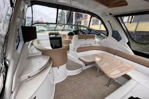  Yacht Photos Pics 2015 Four Winns 375 Vista yacht interior with seating, table, and helm station.
