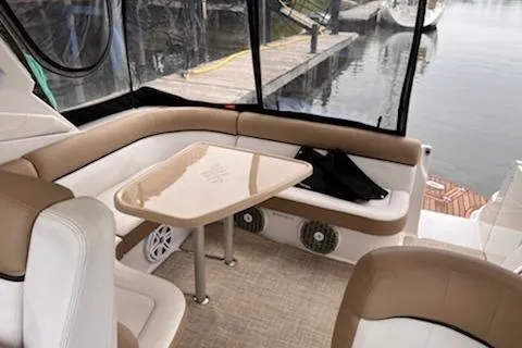  Yacht Photos Pics 2015 Four Winns 375 Vista boat interior with seating and table by the water.