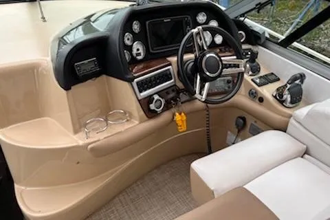  Yacht Photos Pics Cockpit of 2015 Four Winns 375 Vista boat with modern controls and steering wheel.