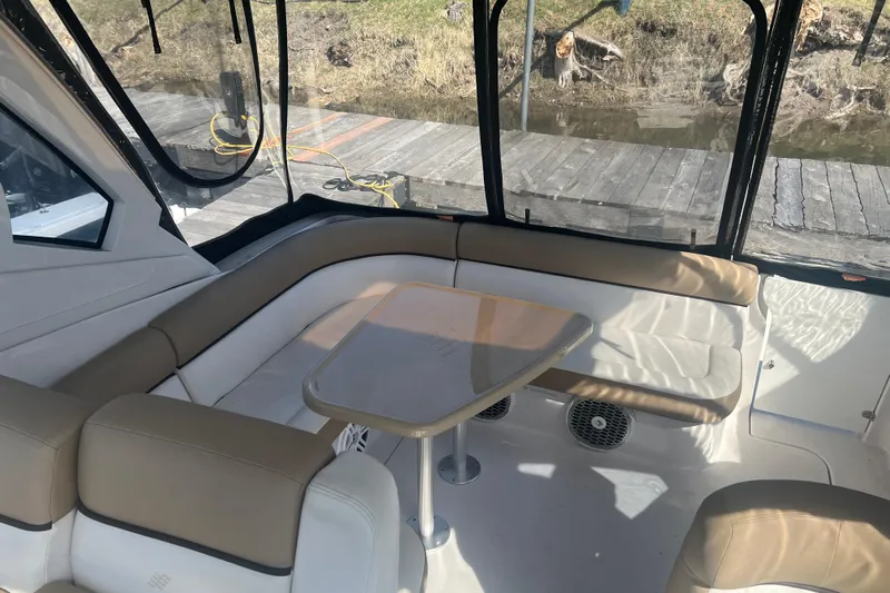  Yacht Photos Pics Interior of 2015 Four Winns 375 Vista boat with seating and table.