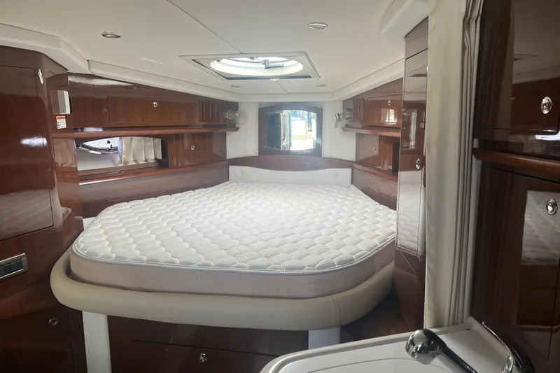  Yacht Photos Pics Luxurious cabin interior of 2015 Four Winns 375 Vista yacht with elegant wood finish.