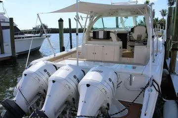 No Name Yacht Photos Pics 2019 Pursuit OS 385 Offshore boat with triple Yamaha engines docked at marina.