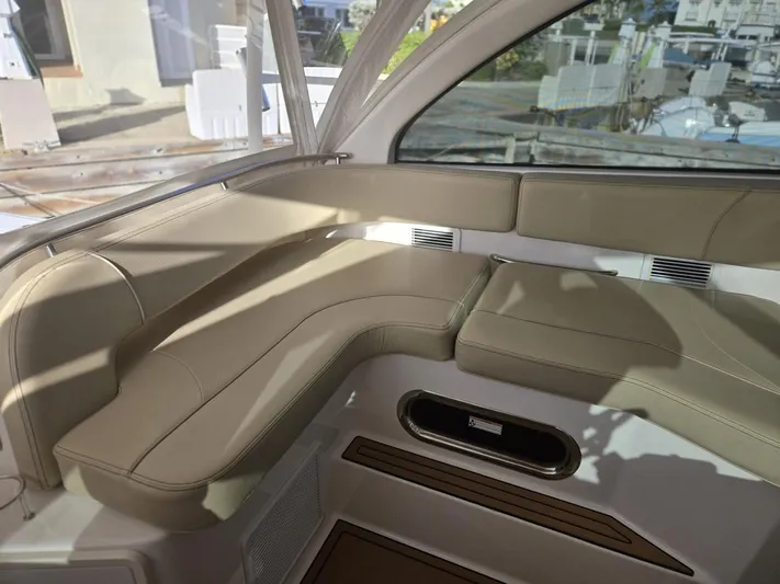 No Name Yacht Photos Pics 2019 Pursuit OS 385 Offshore boat interior with beige seating and modern design.