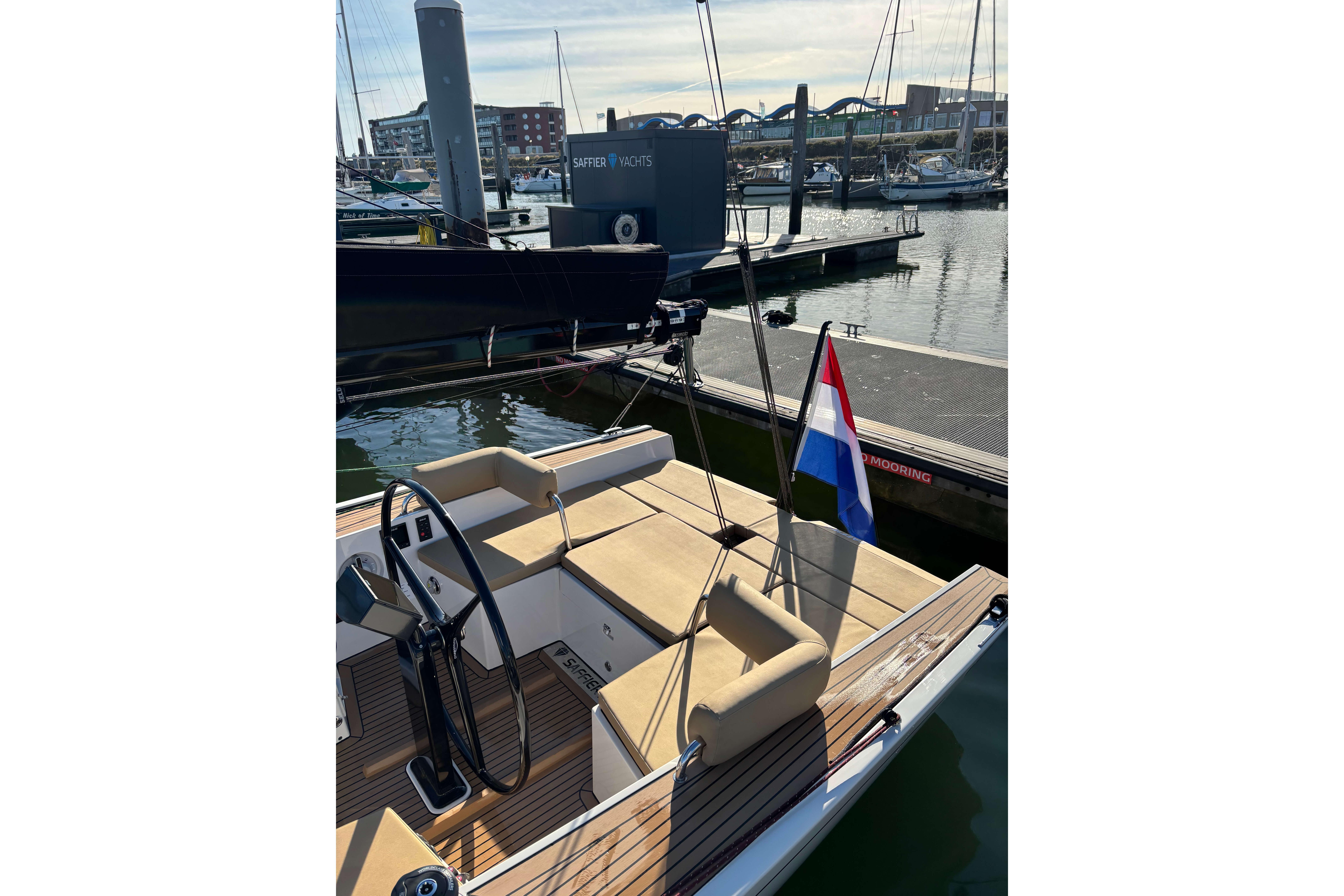 2023 Saffier Se 27 Leisure yacht docked, featuring sleek design and Dutch flag.