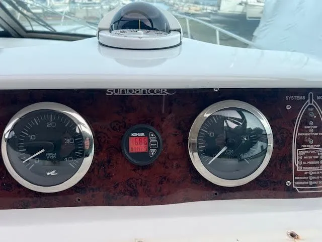 My Girl Yacht Photos Pics Dashboard of a 1995 Sea Ray 450 Sundancer boat with gauges and controls.