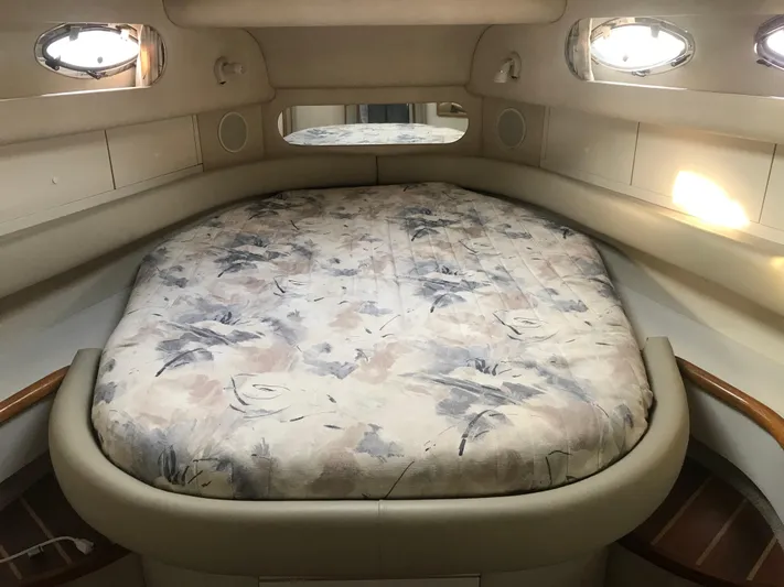 My Girl Yacht Photos Pics Cozy cabin interior of 1995 Sea Ray 450 Sundancer with floral-patterned bed.