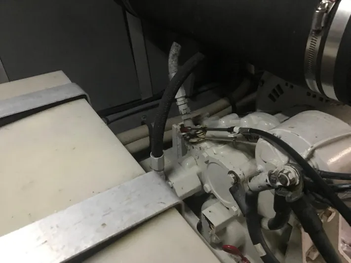 My Girl Yacht Photos Pics Engine compartment of 1995 Sea Ray 450 Sundancer with visible hoses and components.