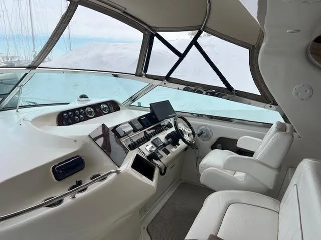 My Girl Yacht Photos Pics Interior of 1995 Sea Ray 450 Sundancer yacht cockpit with modern controls.