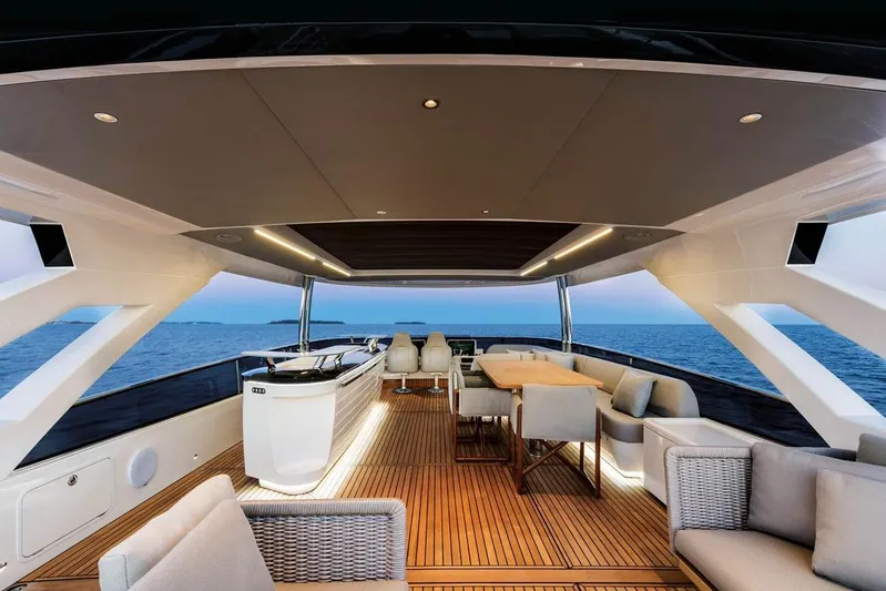  Yacht Photos Pics Luxurious 2019 Absolute Navetta 73 yacht deck with elegant seating and ocean view.