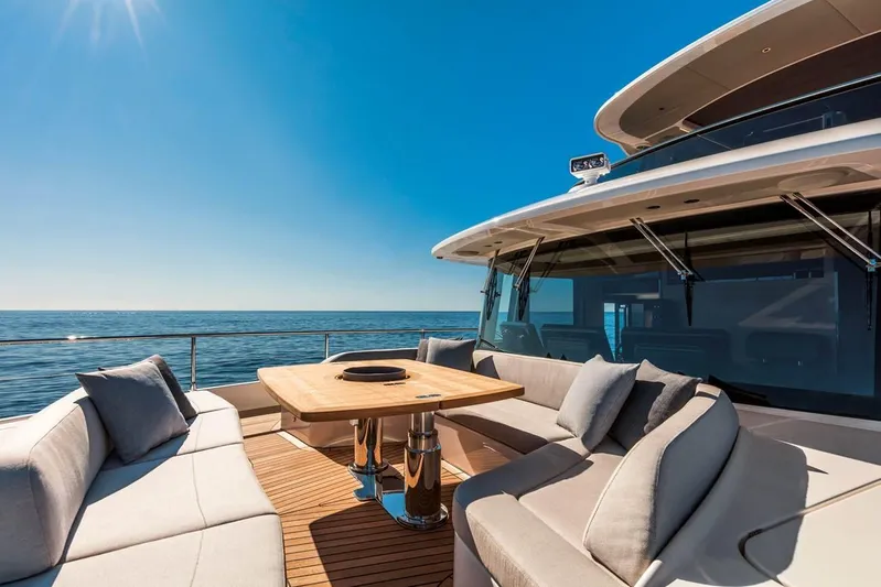  Yacht Photos Pics Luxurious 2019 Absolute Navetta 73 yacht deck with elegant seating and ocean view.