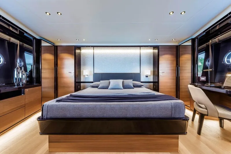  Yacht Photos Pics Luxurious bedroom interior on 2019 Absolute Navetta 73 yacht, featuring modern design and elegant furnishings.