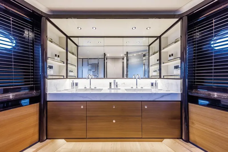  Yacht Photos Pics Luxurious bathroom interior of 2019 Absolute Navetta 73 yacht with double sinks and mirrors.