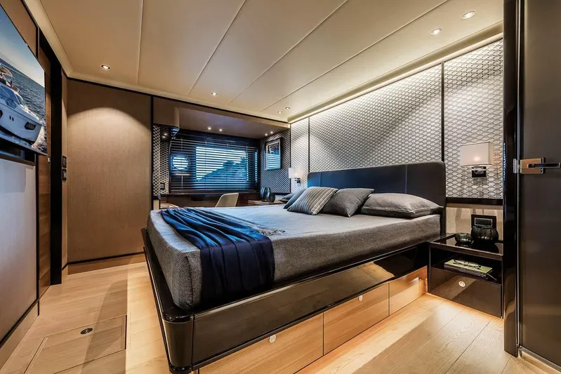  Yacht Photos Pics Luxurious bedroom interior on 2019 Absolute Navetta 73 yacht, featuring modern design and elegant furnishings.