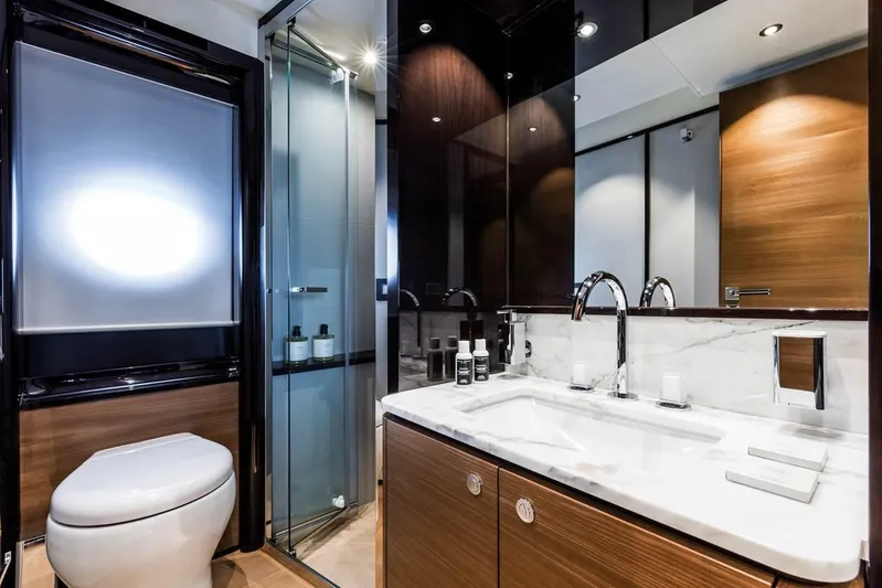  Yacht Photos Pics Luxurious bathroom in 2019 Absolute Navetta 73 yacht with modern fixtures and elegant design.