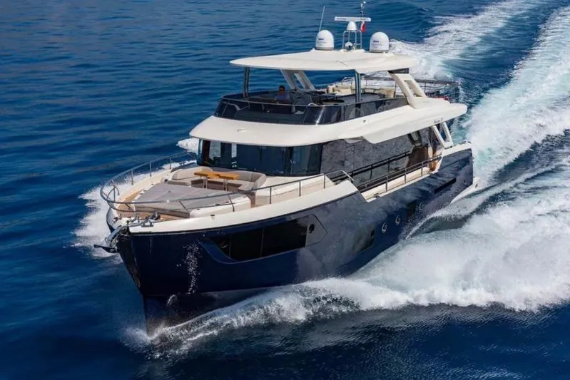  Yacht Photos Pics 2019 Absolute Navetta 73 yacht cruising on open water.