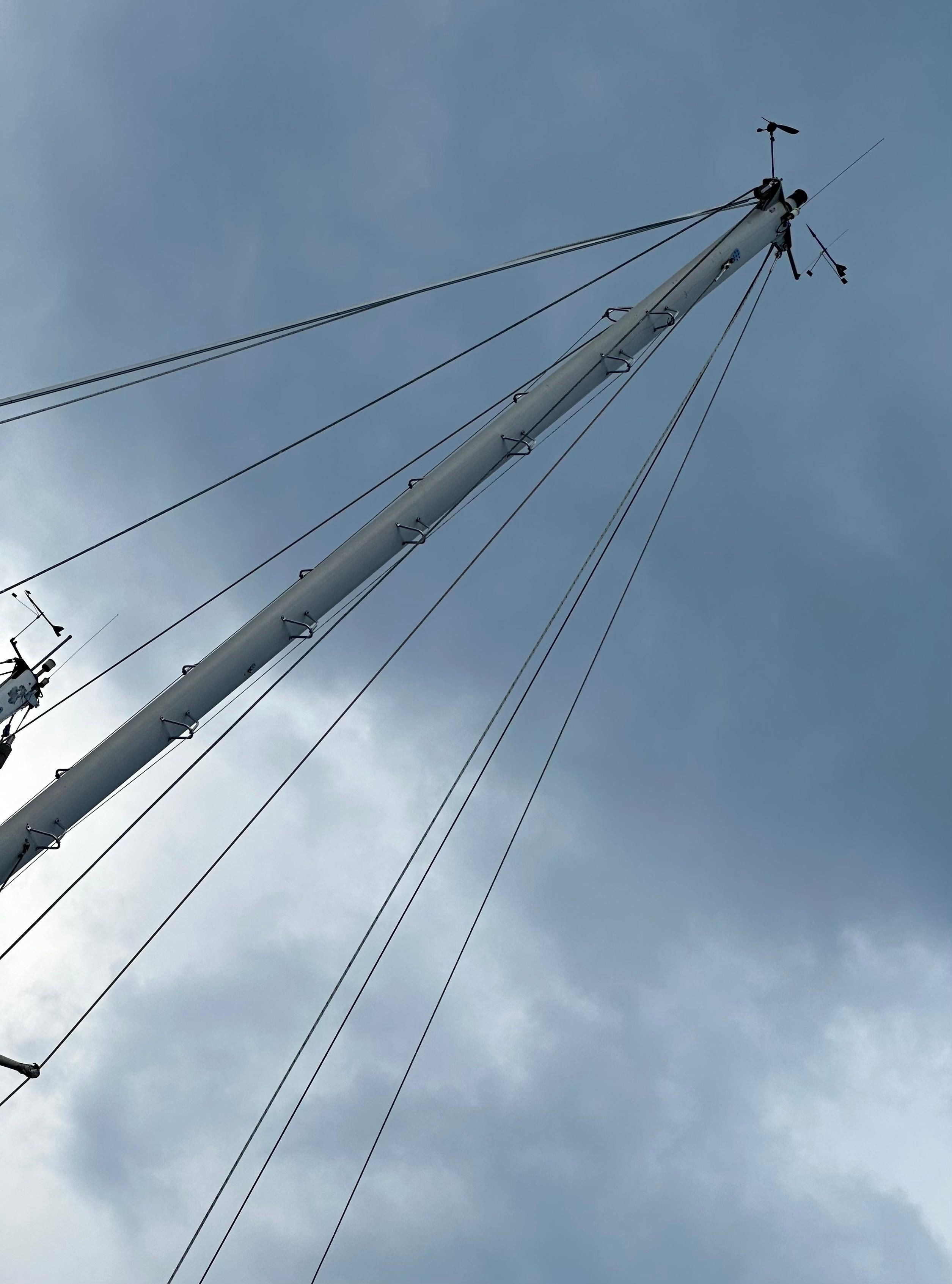 Sailboat mast against cloudy sky, Rival 41C, 1978 model.