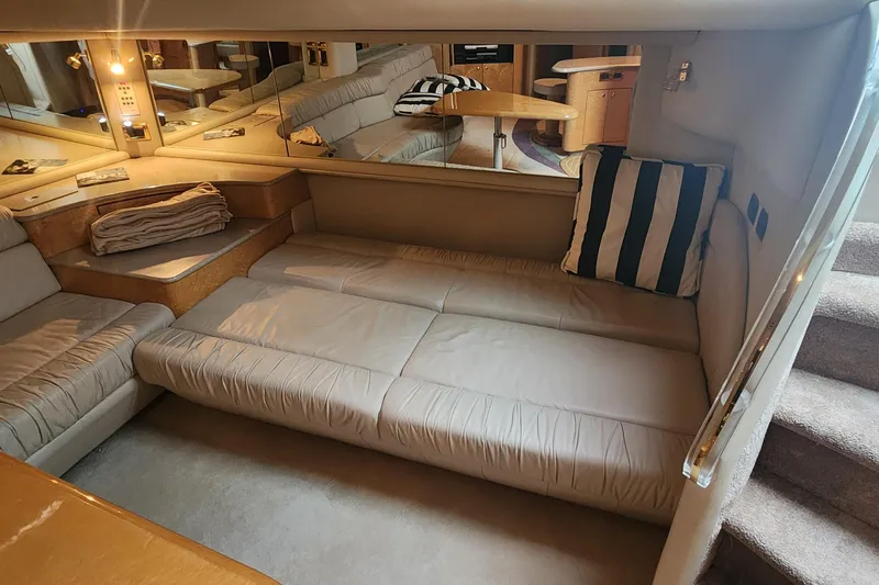  Yacht Photos Pics Interior of 1998 Sea Ray 630 Super Sun Sport yacht with beige seating and striped pillow.