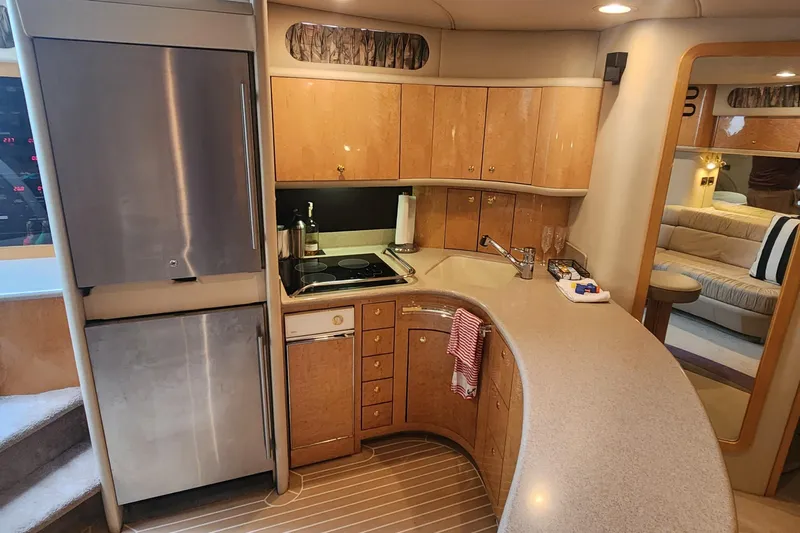  Yacht Photos Pics Luxurious 1998 Sea Ray 630 Super Sun Sport yacht kitchen interior with modern appliances.