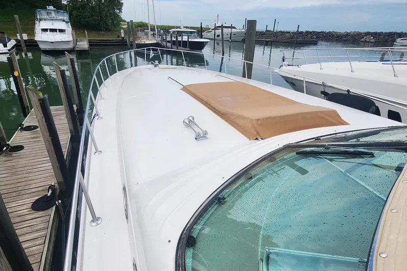  Yacht Photos Pics 1998 Sea Ray 630 Super Sun Sport yacht docked at marina, showcasing sleek design.