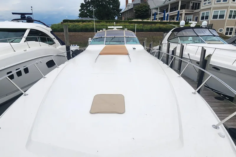  Yacht Photos Pics 1998 Sea Ray 630 Super Sun Sport yacht docked, showcasing sleek design and spacious deck.