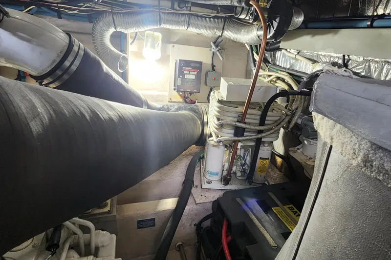  Yacht Photos Pics Engine room of a 1998 Sea Ray 630 Super Sun Sport with visible wiring and components.