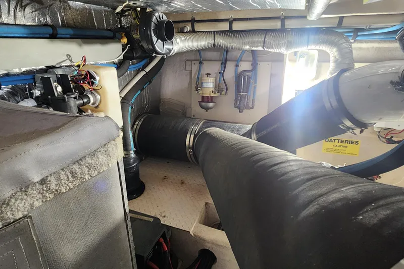  Yacht Photos Pics Engine room of 1998 Sea Ray 630 Super Sun Sport with visible pipes and wiring.