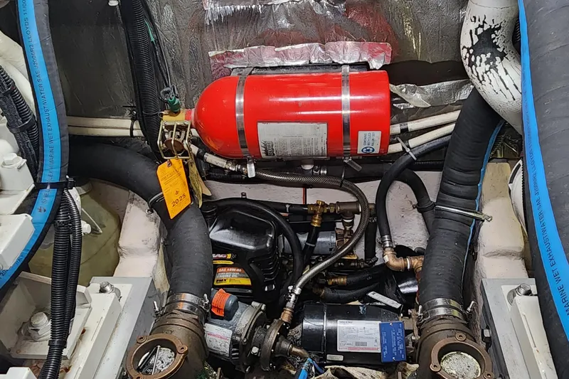  Yacht Photos Pics Engine compartment of a 1998 Sea Ray 630 Super Sun Sport with fire extinguisher and hoses.