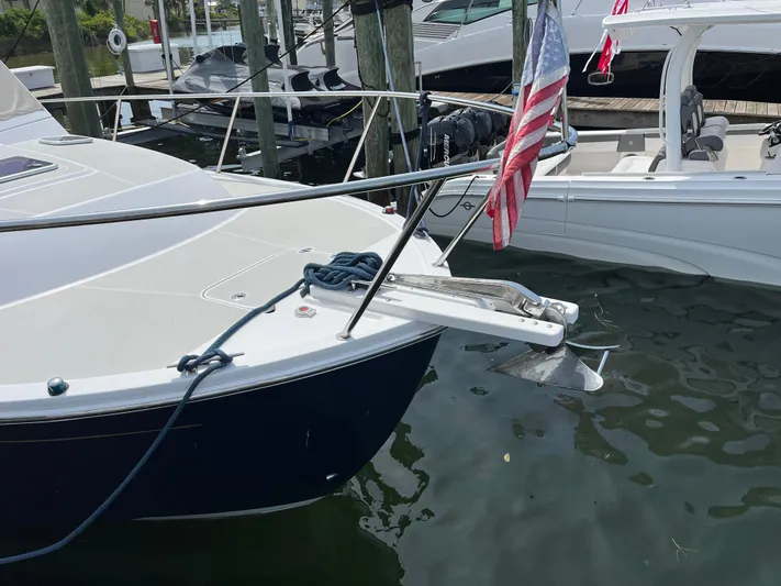  Yacht Photos Pics 2016 Back Cove 34 Express docked with American flag, featuring sleek design and modern amenities.
