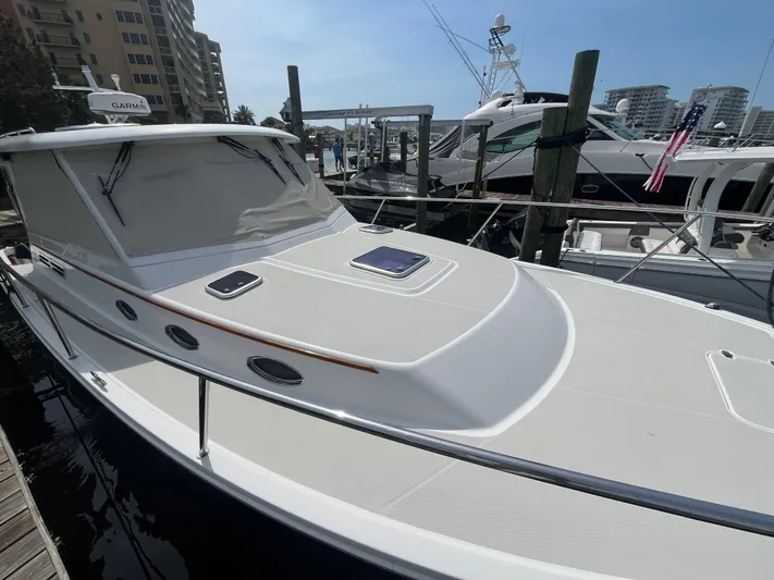  Yacht Photos Pics 2016 Back Cove 34 Express docked at marina, surrounded by other boats.