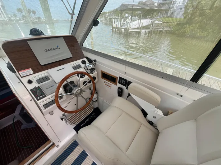  Yacht Photos Pics Helm of 2016 Back Cove 34 Express with Garmin navigation system and leather seat.