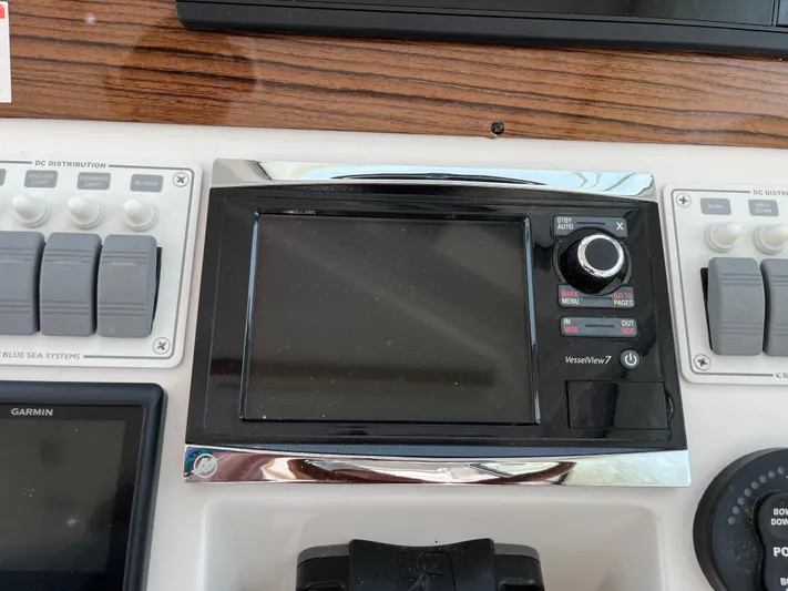  Yacht Photos Pics Control panel of a 2016 Back Cove 34 Express boat with navigation and system switches.