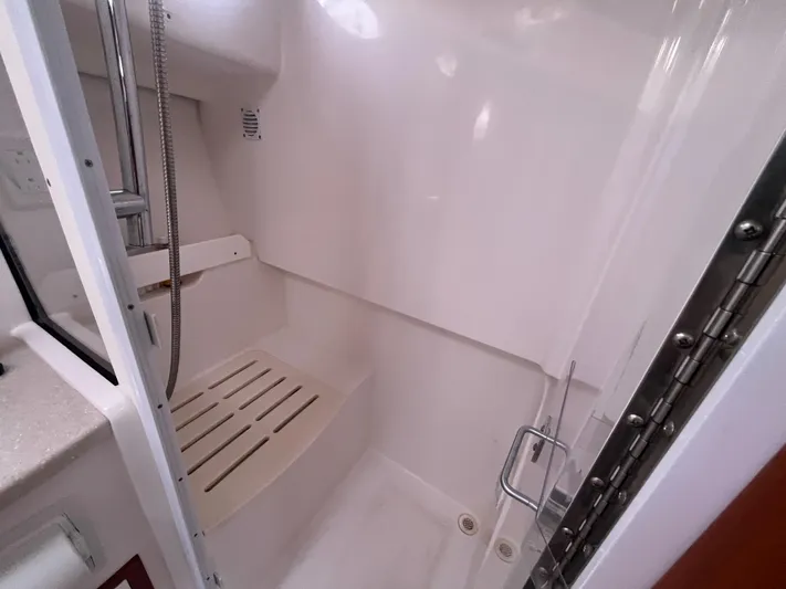  Yacht Photos Pics Shower area in 2016 Back Cove 34 Express boat, featuring a sleek, modern design.