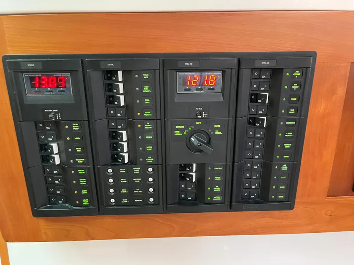  Yacht Photos Pics Electrical control panel on 2016 Back Cove 34 Express boat, featuring digital displays and switches.