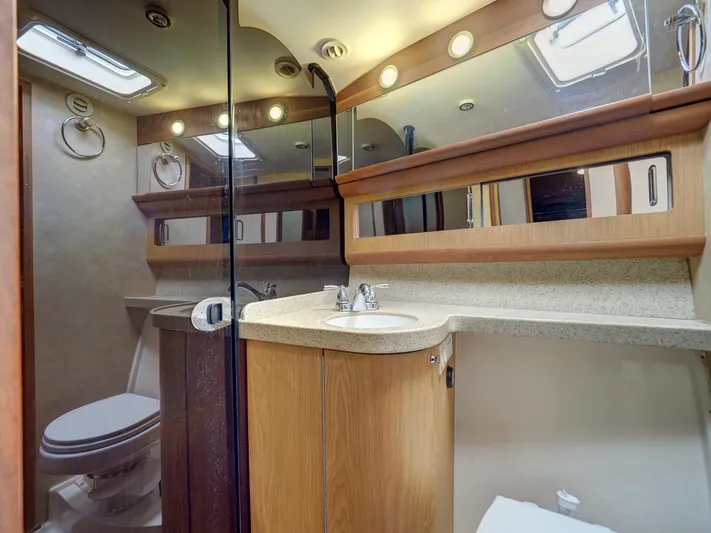 Tight Seal Yacht Photos Pics 2005 Luhrs 41 Convertible yacht bathroom with modern fixtures and ample storage.