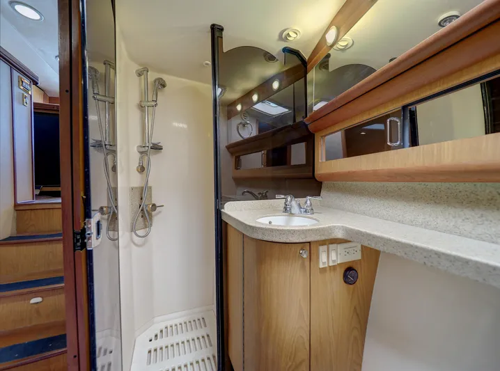 Tight Seal Yacht Photos Pics 2005 Luhrs 41 Convertible yacht bathroom with shower, sink, and mirror.