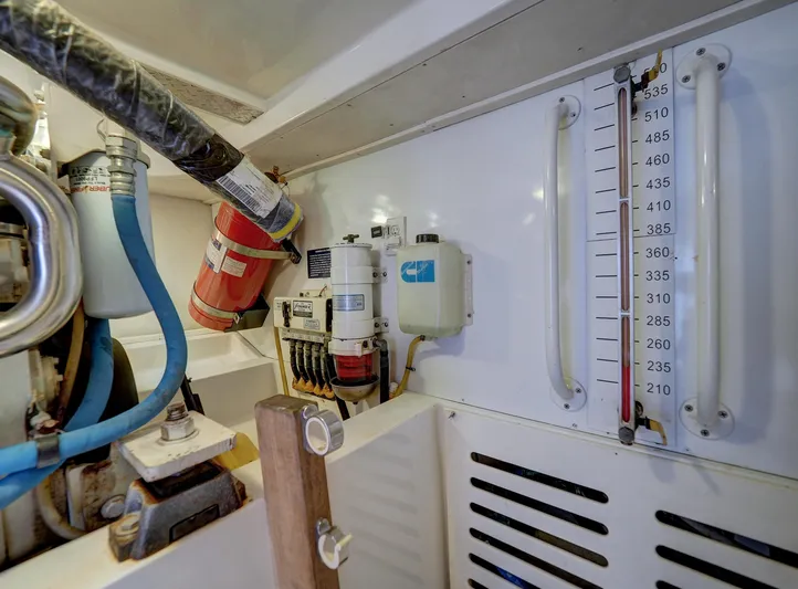 Tight Seal Yacht Photos Pics Engine room of a 2005 Luhrs 41 Convertible boat with various equipment.