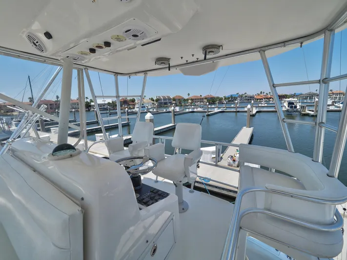 Tight Seal Yacht Photos Pics 2005 Luhrs 41 Convertible yacht helm station overlooking marina.