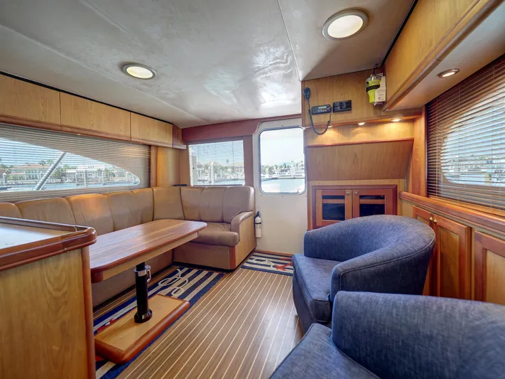 Tight Seal Yacht Photos Pics 2005 Luhrs 41 Convertible yacht interior with seating and wooden finishes.