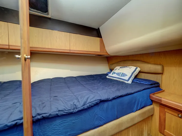 Tight Seal Yacht Photos Pics 2005 Luhrs 41 Convertible cabin with bed and storage cabinets.
