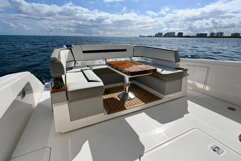 S.y. Royale Yacht Photos Pics 2023 Tiara Sport 38 LS yacht interior with elegant seating and ocean view.