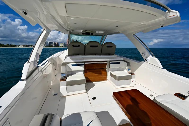 S.y. Royale Yacht Photos Pics 2023 Tiara Sport 38 LS luxury boat interior with seating, ocean view, and modern design.