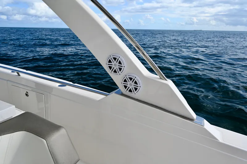 S.y. Royale Yacht Photos Pics 2023 Tiara Sport 38 LS boat detail with ocean backdrop, featuring sleek design and speakers.