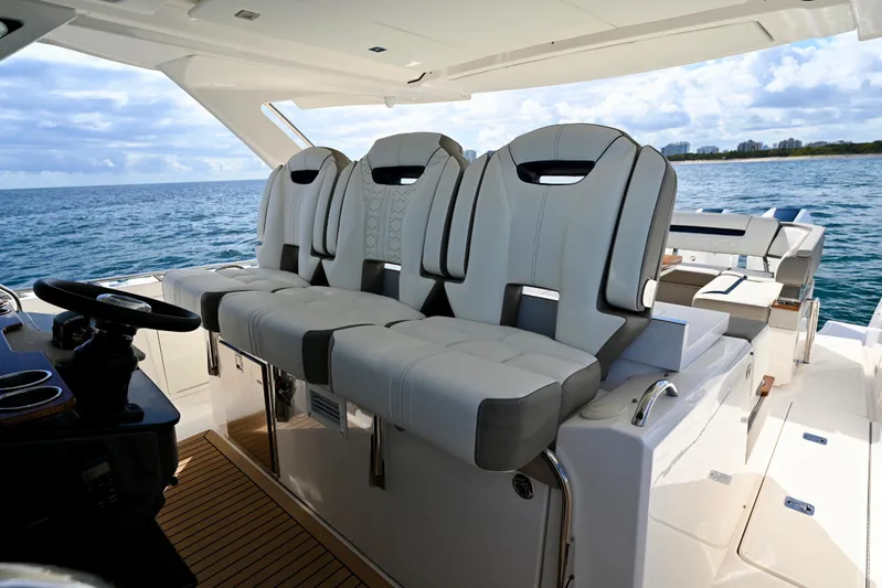 S.y. Royale Yacht Photos Pics Luxury seating on 2023 Tiara Sport 38 LS yacht, ocean view in background.