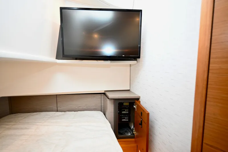 S.y. Royale Yacht Photos Pics 2023 Tiara Sport 38 LS cabin with TV and storage cabinet.
