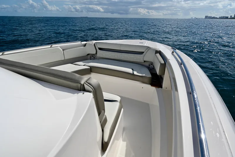 S.y. Royale Yacht Photos Pics 2023 Tiara Sport 38 LS boat with luxurious seating on open water.
