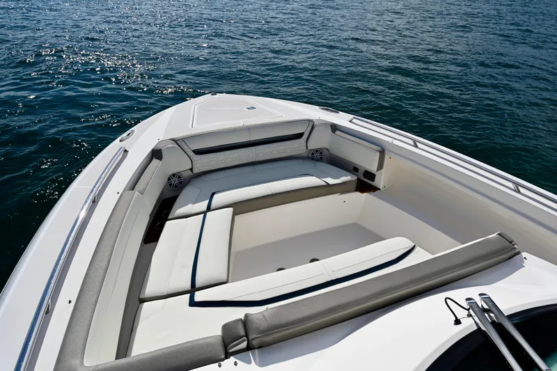 S.y. Royale Yacht Photos Pics 2023 Tiara Sport 38 LS boat with luxurious seating on calm water.